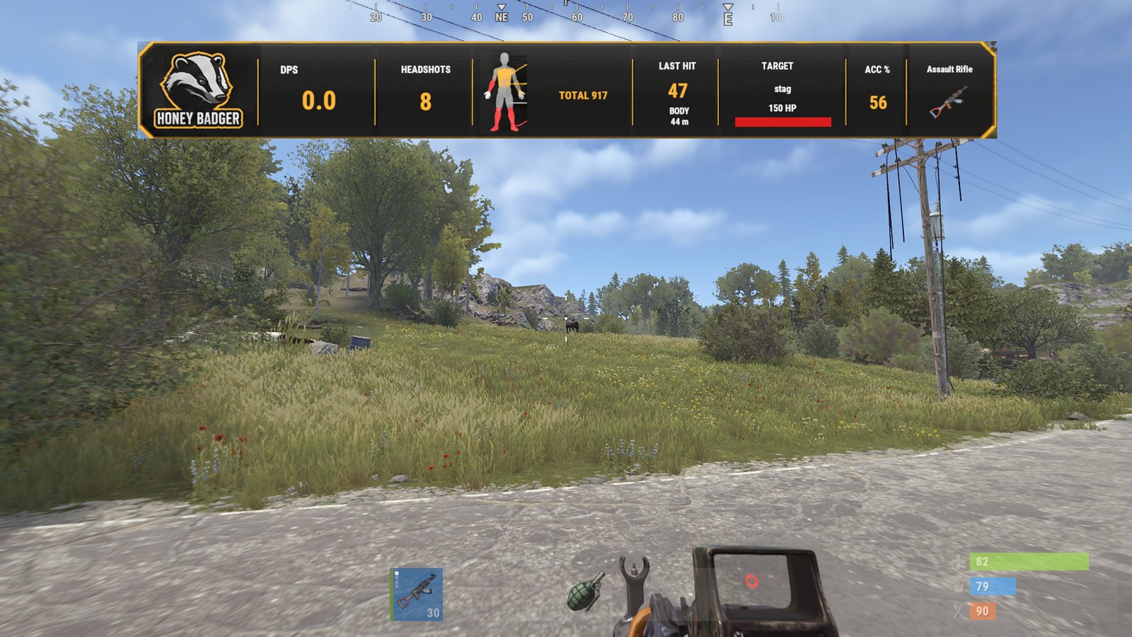 Real in-game frame: the Honey Badger DPS band under the compass on a Carbon server, showing 8 headshots, total 917, last hit 47 to the body at 44 metres, target Stag at 150 HP, accuracy 56 percent, Assault Rifle